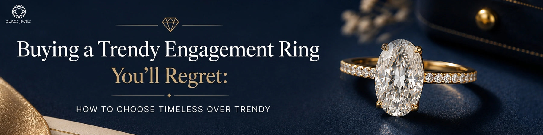 Oval diamond engagement ring with a gold band displayed on dark fabric, with a black jewelry box and white flowers in the background.