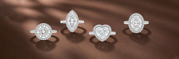image showing halo ring featuring a colored lab-grown diamond heart, cushion, and oval shapes, Beautifully set for a sparkling finish 