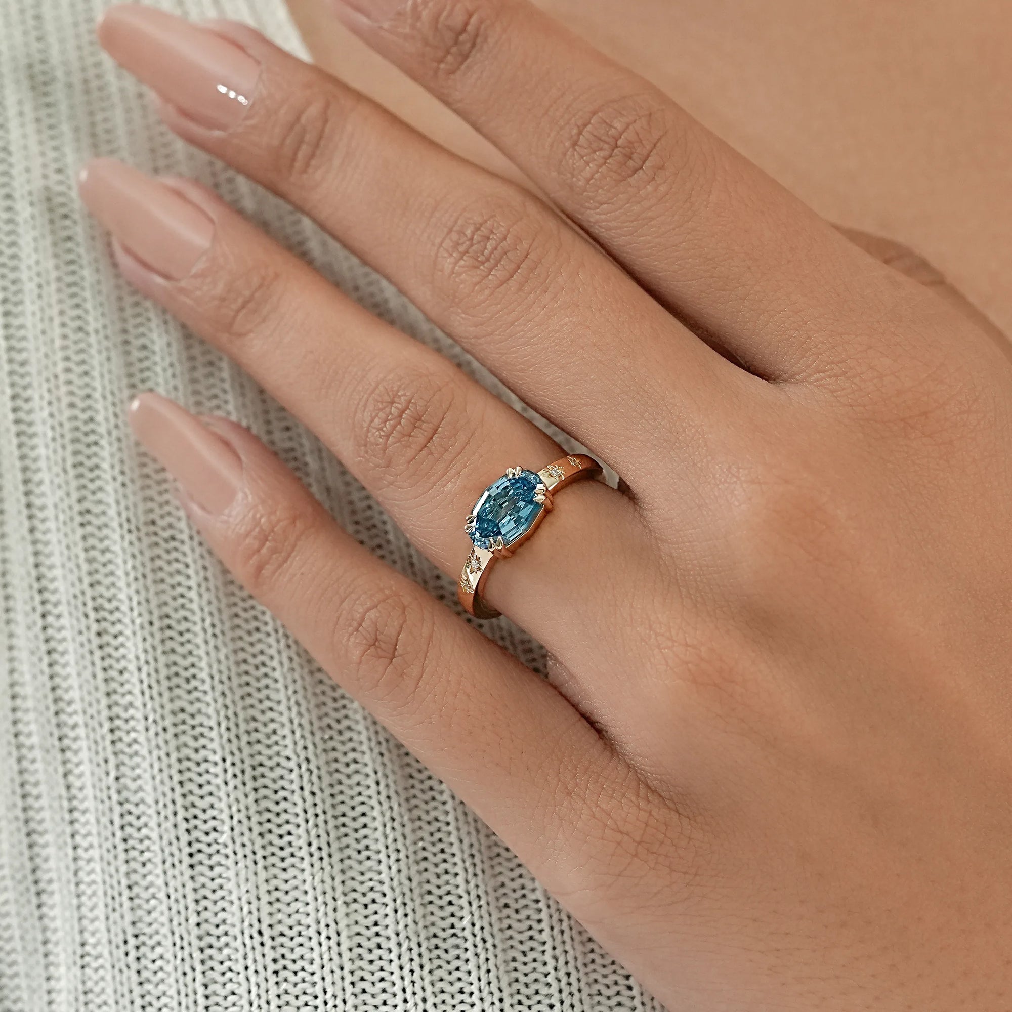 East-West Blue Step Cut Oval Accent Diamond Ring Rings