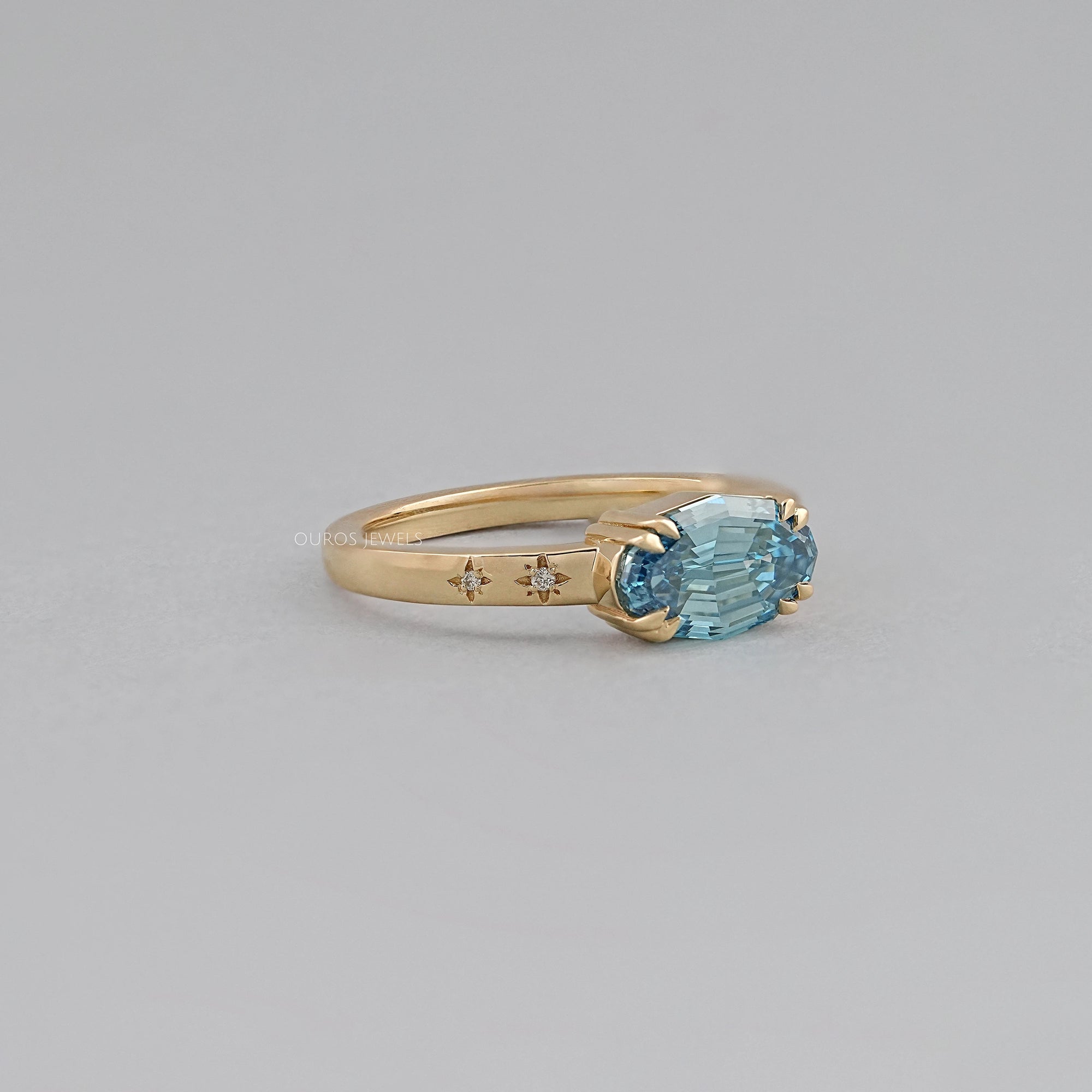 East-West Blue Step Cut Oval Accent Diamond Ring Rings